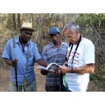 Tony consults with local birders. Photo by Rick Taylor. Copyright Borderland Tours. All rights reserved.