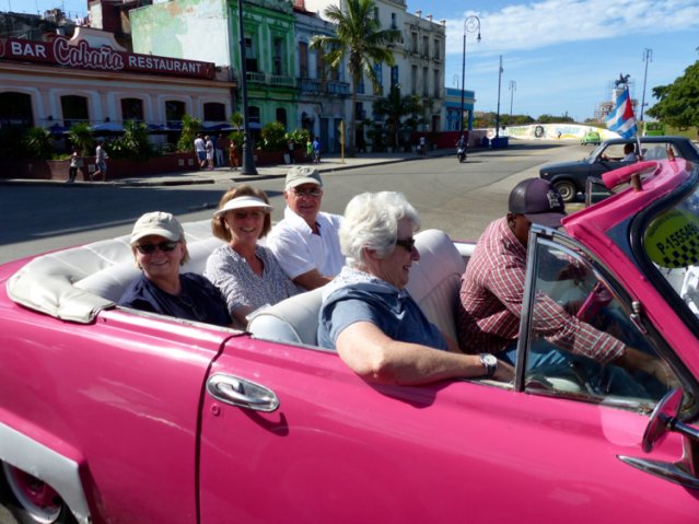 Pink converrtible ride in old havana. Photo by Rick Taylor. Copyright Borderland Tours. All rights reserved.